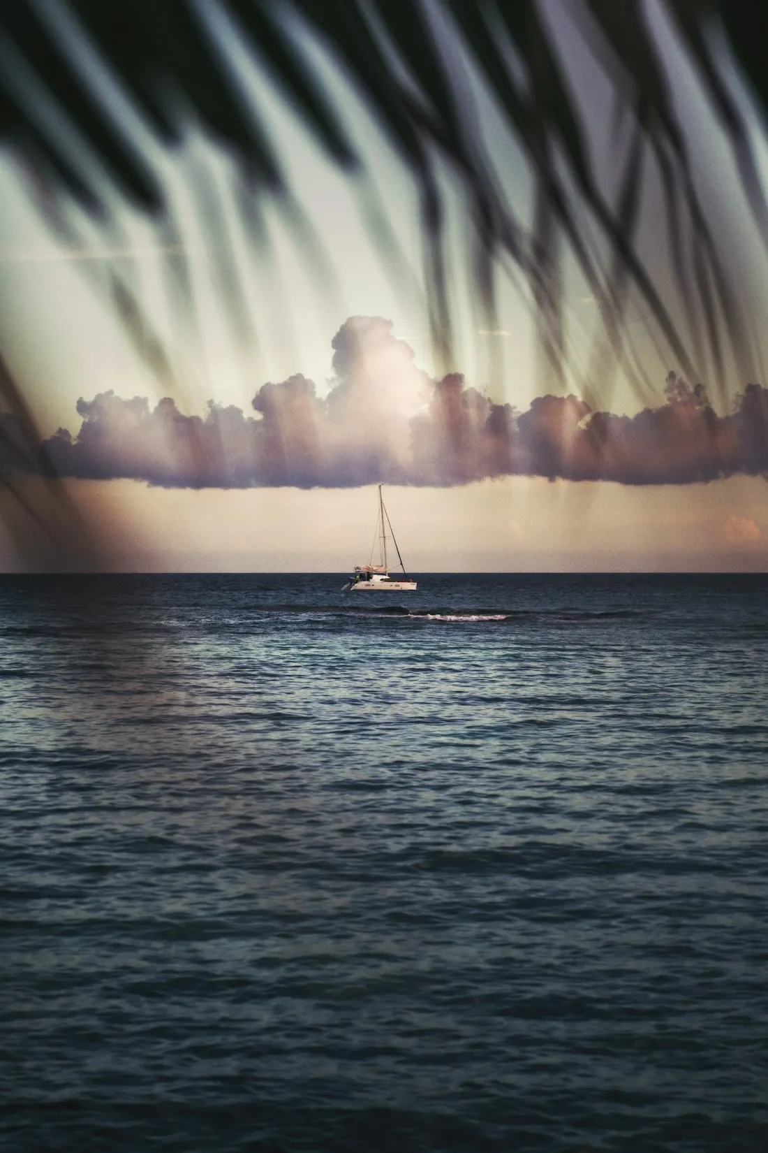 A boat on turquoise water on the Riviera Maya coast